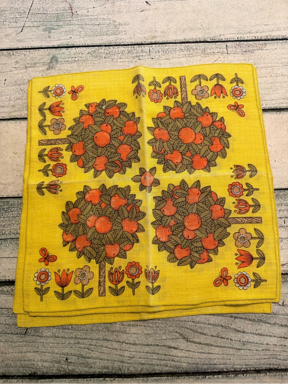 Vintage 70’s yellow with orange tree and flowers pattern 4 napkins. Some fading.